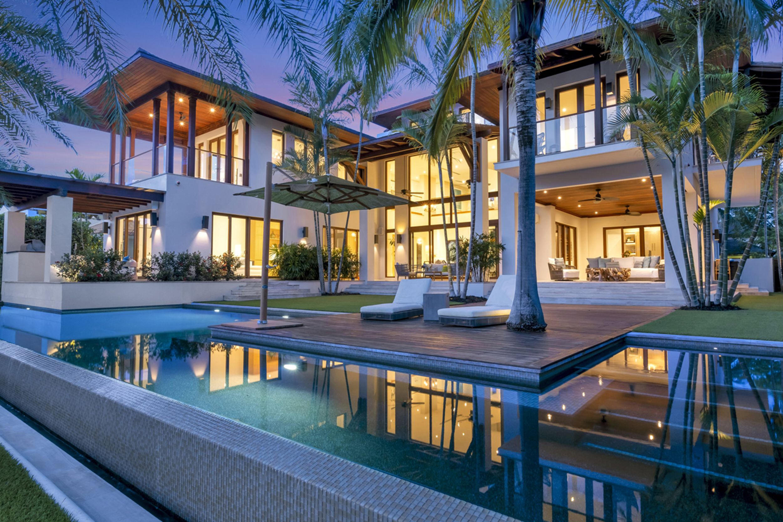 Luxury South Florida home with pool at dusk